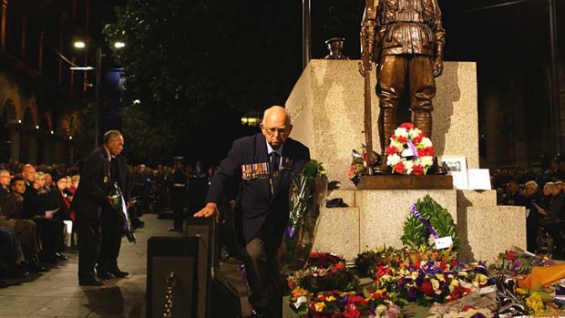 A solemn place: Walter Scott-Smith at work during the dawn service.