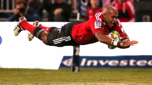 Nemani Nadolo of the Crusaders dives over to score a try during their rout of the ACT Brumbies in Christchurch.