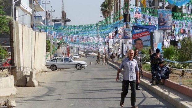 Electoral posters flood the street in the northern city of Kirkuk.