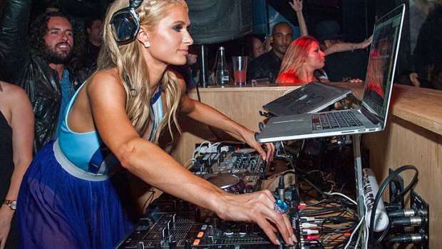 Paris Hilton DJing at the launch party for her new single "Come Alive".