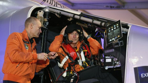 Epic flight ... Swiss pilot Andre Borschberg (right) and his compatriot pilot Bertrand Piccard get ready to fly the Solar Impulse 2 at Al Bateen airport in Abu Dhabi on Monday.