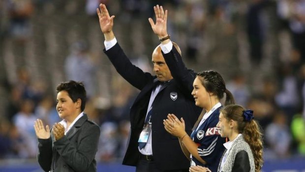 Kevin Muscat and his children thank supporters after Victory's win over the Wanderers.
