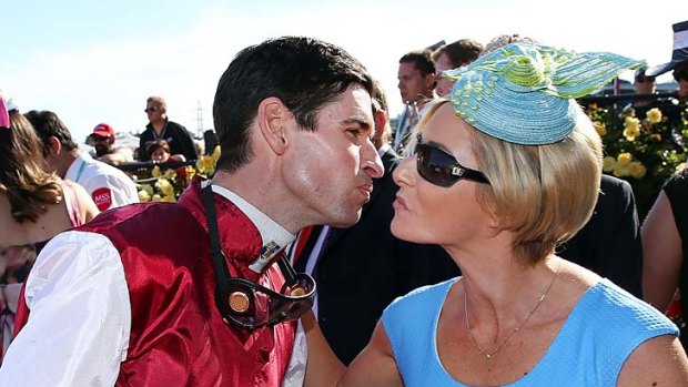 Steven Arnold gets a kiss from his wife, Kate, after his winning ride on Launay.