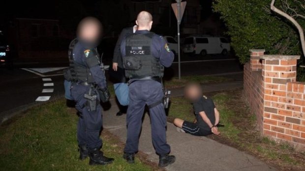NSW Police officers execute search warrants in raids across Sydney on Thursday, September 18.