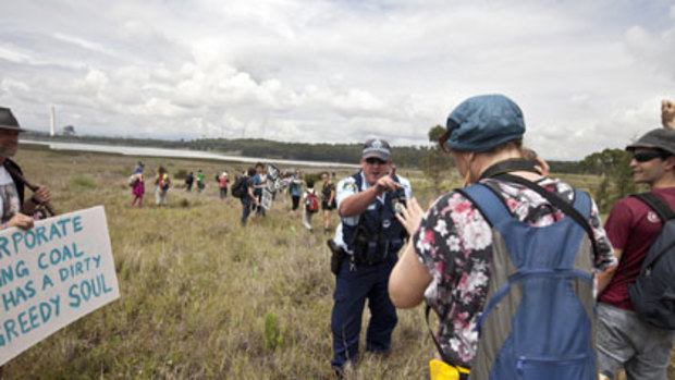 Clash ... police order protesters off power station property.