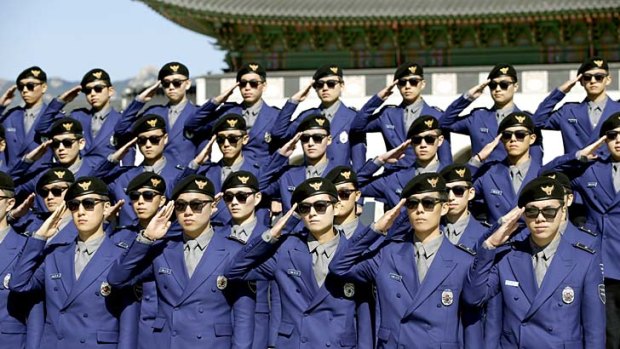 Around 100 young policemen and women make up the first batch of Seoul's new tourist police force - formed to protect tourists from being ripped off during their stay in the South Korean capital and wearing uniforms designed by rapper Psy's costume designer.