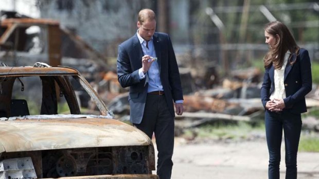 Britain's Prince William and his wife Catherine, Duchess of Cambridge, visit a fire-devastated town in Slave Lake, Alberta.