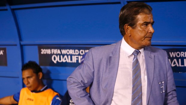 Honduras coach Jorge Luis Pinto, right, stands in in the dugout during a World Cup qualifying soccer match against Mexico this month.