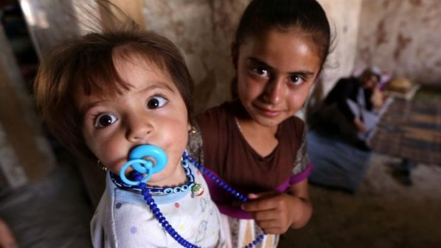 Iraqi Yazidi children who fled the violence in the northern Iraqi town of Sinjar.