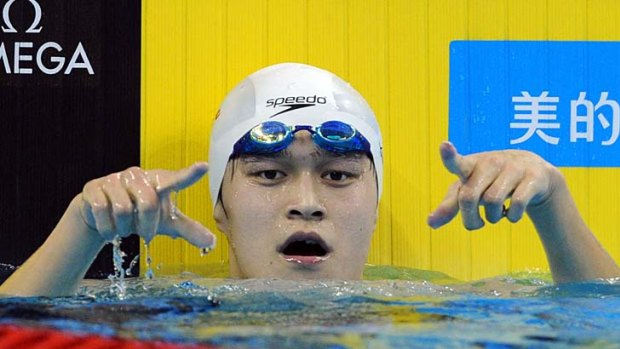 World record ... China's Sun Yang wins the men's 1500-metre freestyle swimming.