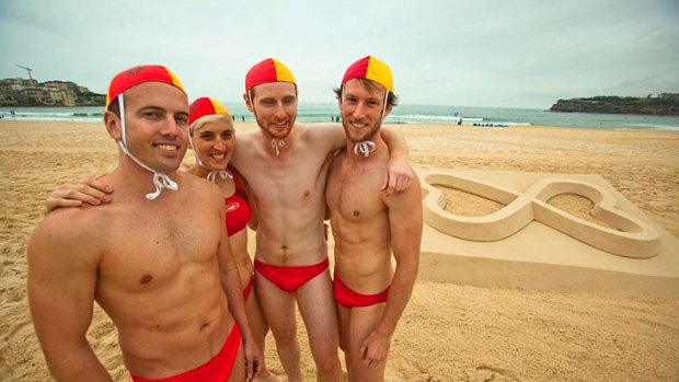 "The right to be" ... the new look Sydney Mardi Gras logo is unveiled at Bondi Beach yesterday.