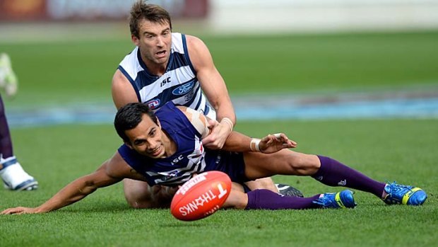 Corey Enright and Fremantle's Danyle Pearce battle for possession during the qualifying final on Saturday.