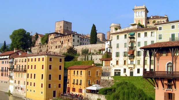 A slower pace ... multicoloured houses and a medieval castle in Bassano del Grappa.