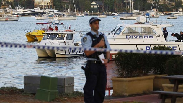 ''My heart goes out to them'' &#8230; police divers remove the body of the woman who went missing off her boat in Rose Bay.