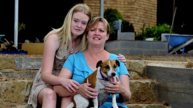 Fiona Vickery of Yass, with her daughter Skye, 16 and the family dog Jasper. Fiona's husband was killed in a workplace accident in December 2011.