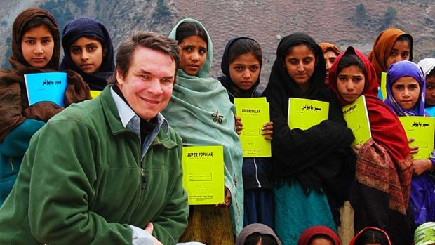 Campaign .. Greg Mortenson with children in Pakistan.