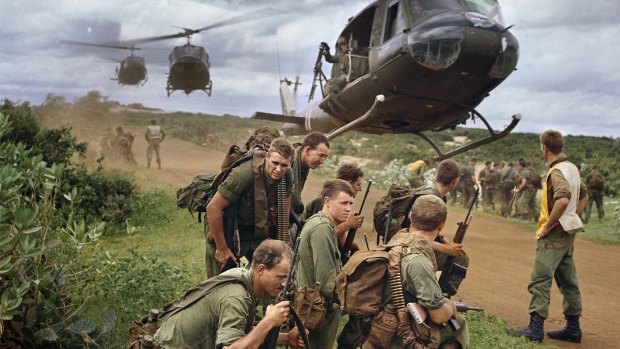 Members of the Royal Australian Regiment waiting to be airlifted by US Army helicopters from an area just north of Phuoc Hai on 26 August 1967.