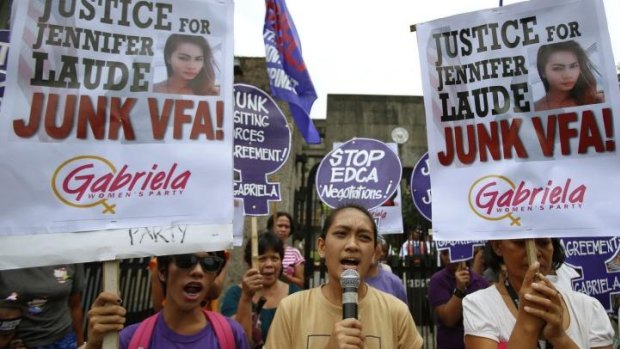 Protesters chant anti-US slogans during a rally against the killing of a 26-year-old Filipino transgender Jennifer Laude, outside the Department of Foreign Affairs in Manila.