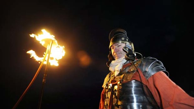 Beacons of light ... as night descended across northern Britain on Saturday, up to 500 volunteers, some dressed as Roman soldiers hold flaming torches to light up Hadrian's Wall.