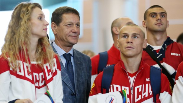 Boxer Vladimir Nikitin (second from right) with other Russian athletes on their way to Brazil.