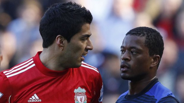 Liverpool's Luis Suarez (left) was banned for eight matches for racially abusing Manchester United's Patrice Evra.