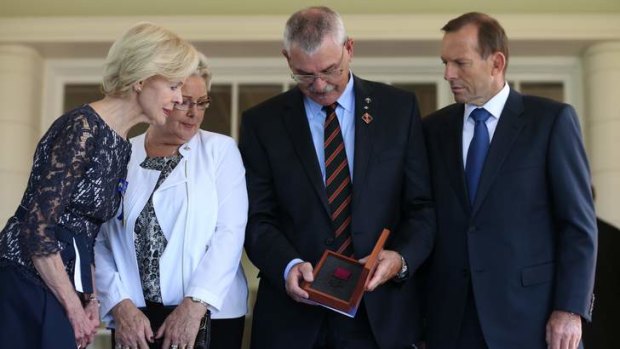 Tribute to fallen: Quentin Bryce, Kaye and Doug Baird, and Tony Abbott.