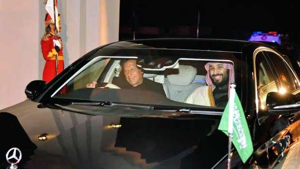 Pakistani PM Imran Khan, left, drives Saudi Crown Prince Mohammed bin Salman in Rawalpindi, Pakistan, on Sunday.
