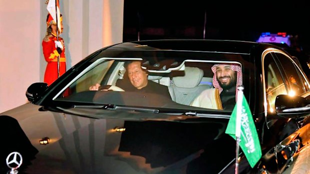 Pakistani PM Imran Khan, left, drives Saudi Crown Prince Mohammed bin Salman in Rawalpindi, Pakistan, on Sunday.