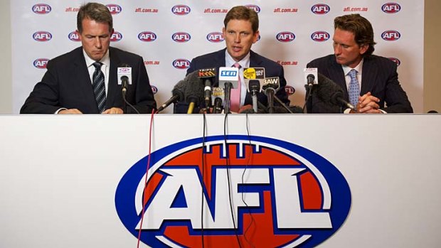 Coming clean: Essendon chief executive Ian Robson (left), club president David Evans and coach James Hird face the media yesterday.