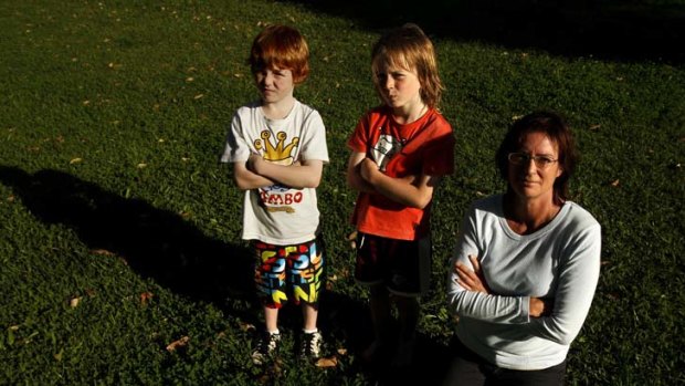 Not bowing to a ''corporate bully'' ... Jane Oakley with Jack Williams, left, and Fin Oakley Mclean.