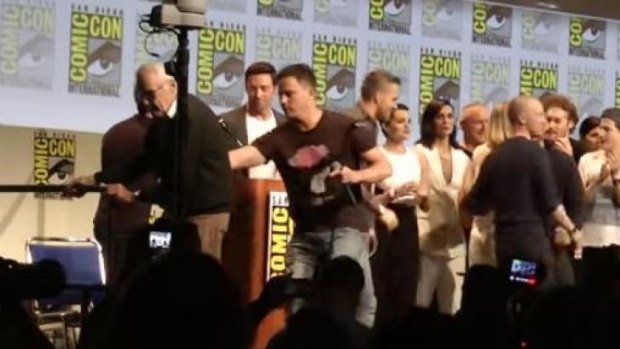 Channing Tatum seen helping Marvel comic book writer Stan Lee off stage at Comic-Con.