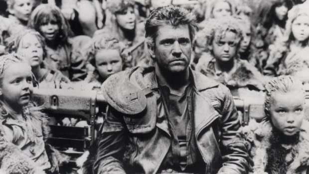 Mel Gibson surrounded by child actors in <i>Mad Max: Beyond Thunderdome.</i>