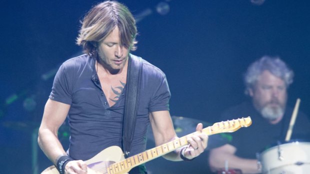 Caboolture boy turned country-rock crossover star Keith Urban delivered generority - and quite a few guitar solos-  to a packed house at the start of his Australian tour, at the Brisbane Entertainment Centre on Friday, January 25, 2013.