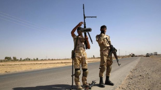 Fighters from the Shi'ite Badr Brigade militia set up a mobile checkpoint in Suleiman Beg, northern Iraq.