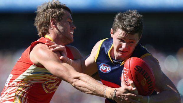 Gold Coast's Maverick Weller puts Patrick Dangerfield under pressure in round 23 where the Crow is tipped to poll three votes.