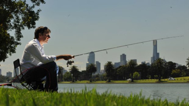 A fisherman at Albert Park Lake.