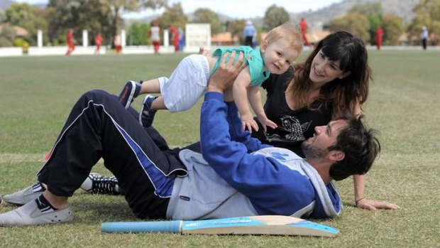 Jono Dean relaxes with wife Kim and nine-month-old son Nixon on Sunday at Chisolm.