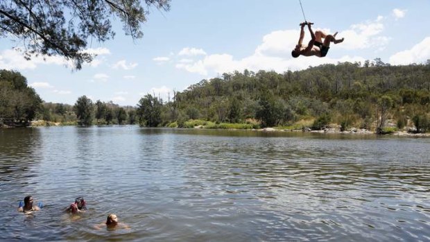 Joel Patton from Woden swinging out into the Murrumbidgee River.