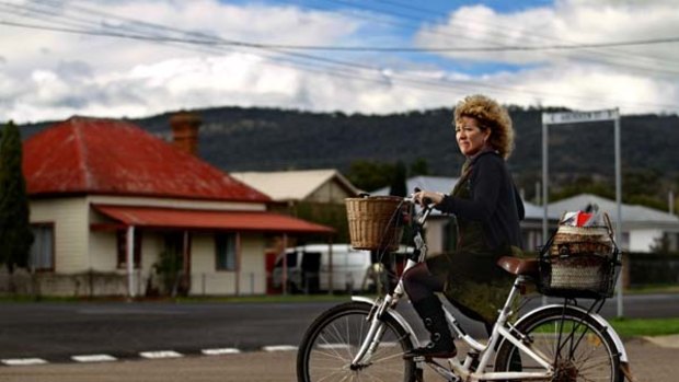 Scone unadorned ... Sue Abbott in the town where she was originally fined for riding her bicycle without a helmet. The conviction has been quashed.