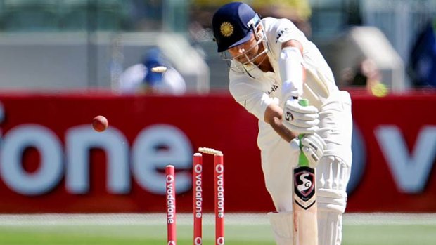 Indian batsman Rahul Dravid is clean bowled by paceman Ben Hilfenhaus.