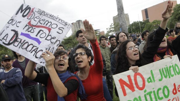 Protesters in Asuncion denounce Paraguay's the impeachment process.