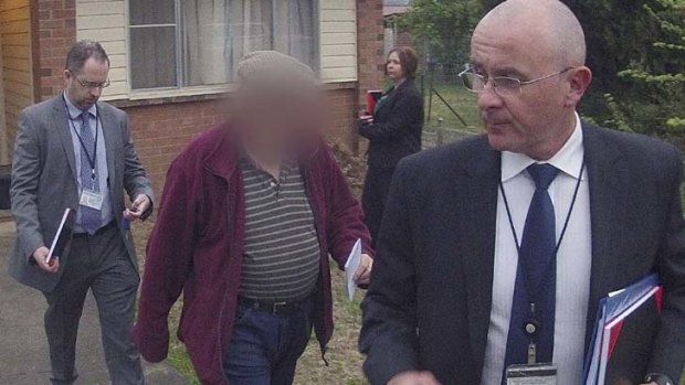 Arrested &#8230; detectives with Father F in Armidale yesterday. He faces 25 child sex abuse charges.