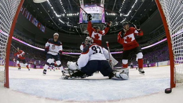 Over the line: Canada's Jamie Benn celebrates after scoring past USA's goalie Jonathan Quick.