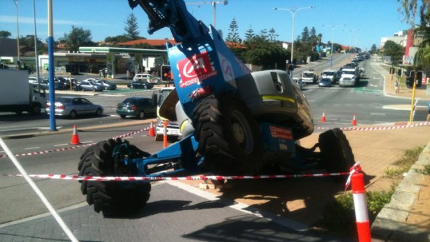 The cherry picker was heading along West Coast Highway when it tipped.