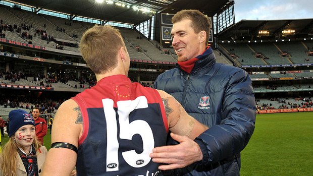 Jim Stynes congratulates Ricky Petterd after the Demons' 96-point win over Adelaide.