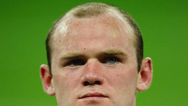 Before ... Wayne Rooney, pictured on May 28.