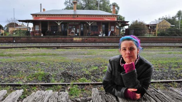 Local resident Belinda Michael at the disused Talbot train station and the landmark building of yesteryear.