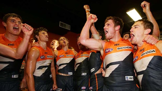 The overjoyed GWS Giants celebrate their win over lowly Melbourne at Skoda Stadium.