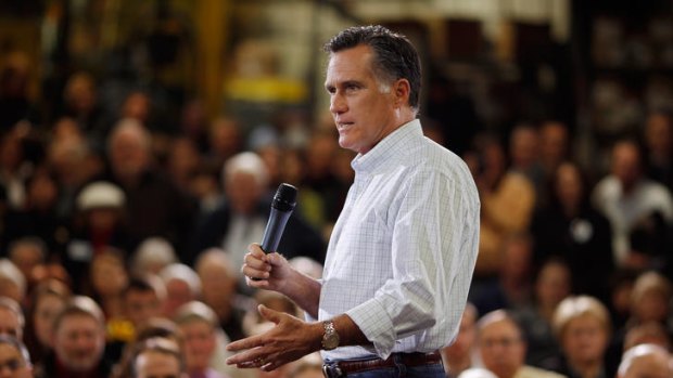 Republican presidential candidate Mitt Romney addresses a large, mainly white audience, in Iowa.