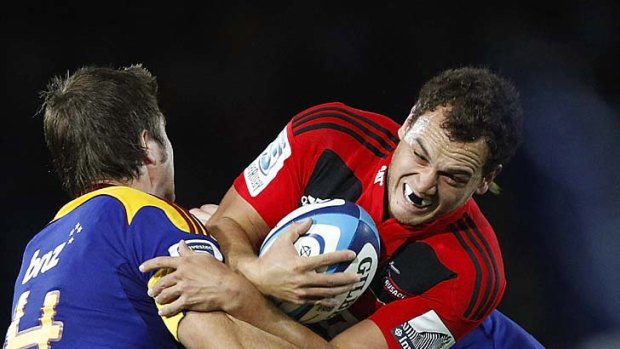 No way through: Israel Dagg is stopped by the Highlanders.